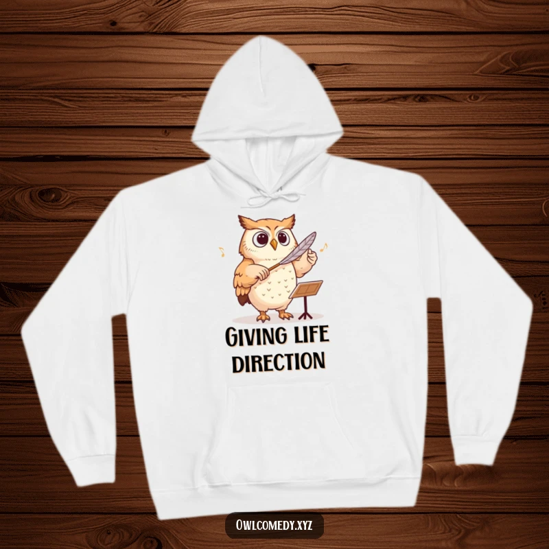 Funny owl conducting an orchestra with a feather baton, depicted on a warm and cozy hoodie.