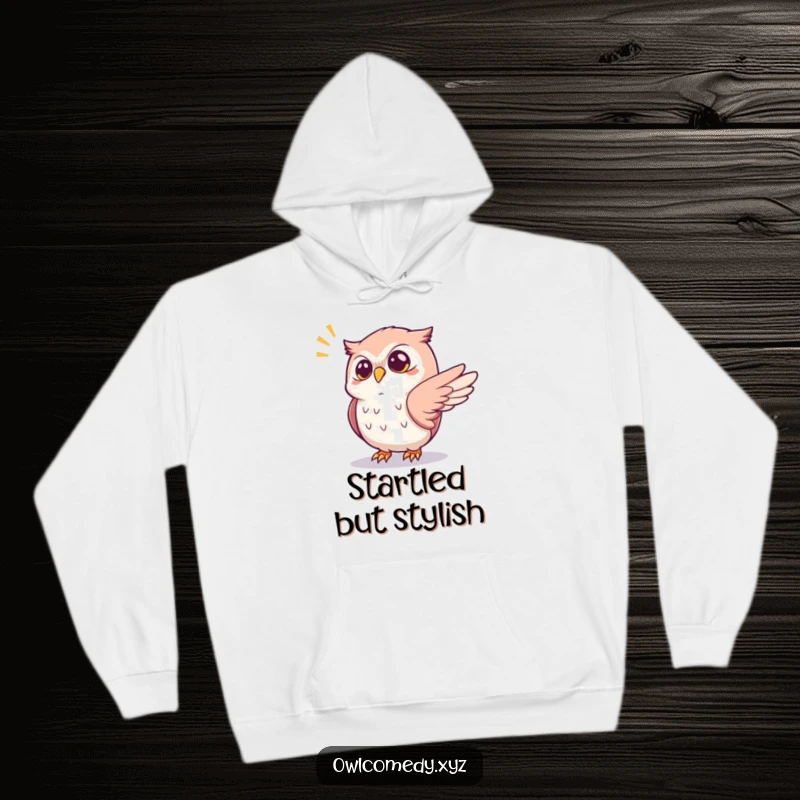 Funny startled kawaii owl hoodie, with one wing outstretched reacting to a popping sound, a cozy and humorous hooded sweatshirt.