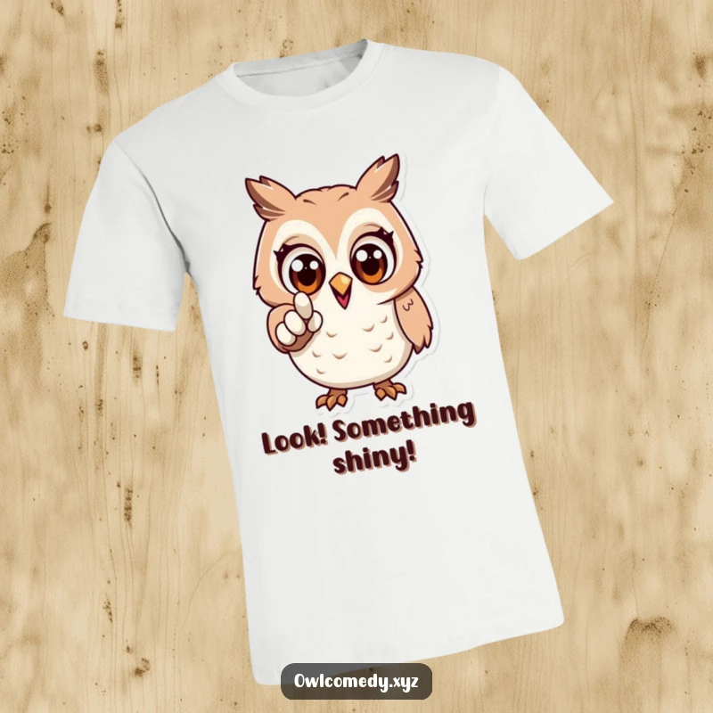 Funny t-shirt print of an owl with wide, excited eyes, pointing forward with enthusiasm and a sense of direction.